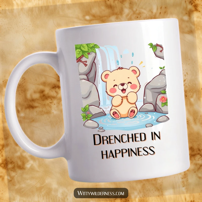 Funny mug showing a happy bear cub playfully swatting at a cascading waterfall, full of joyous energy.