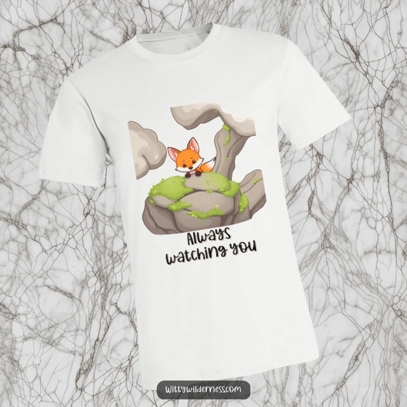 Funny t-shirt with a sly fox peeking out from behind a large, moss-covered rock, looking quite curious.